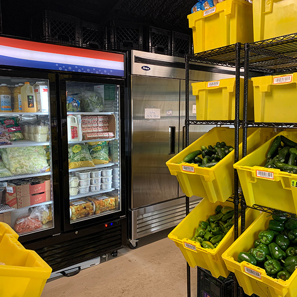 inside WellHouse, view of fridges and food bins